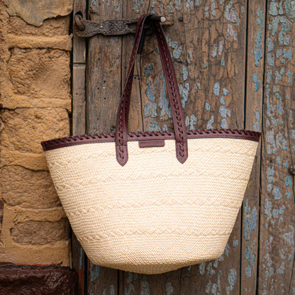 Bolsa Paola | Cesta tejida en fibra natural intervenida en cuero color vinotinto